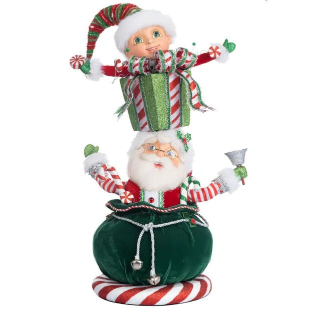 Santa in sack and elf ontop present box stacked vertically